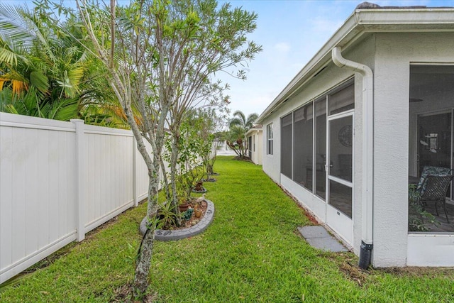 view of yard with a sunroom