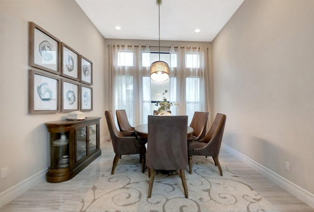 dining area featuring recessed lighting and baseboards