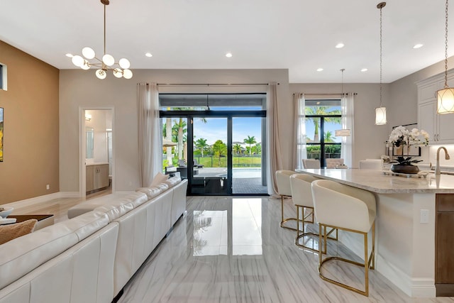 living room with recessed lighting and baseboards