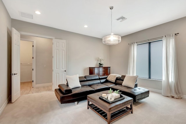 living area featuring recessed lighting, visible vents, light carpet, and baseboards