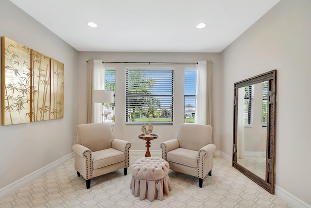 living area with baseboards and recessed lighting