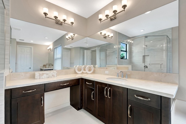 full bathroom featuring a stall shower and vanity