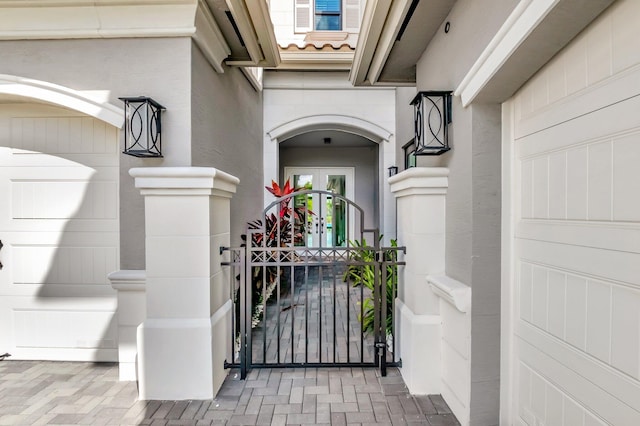 entrance to property with a gate and a tile roof