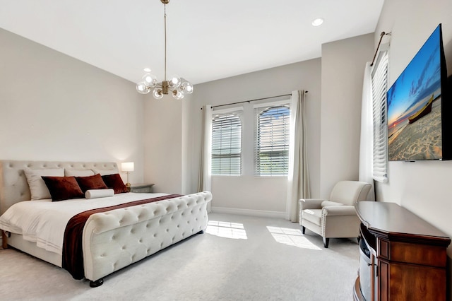 bedroom featuring baseboards, an inviting chandelier, and light colored carpet