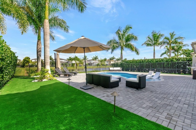 view of pool with a yard, a fenced backyard, a fenced in pool, and a patio