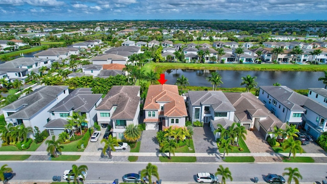 aerial view featuring a water view and a residential view