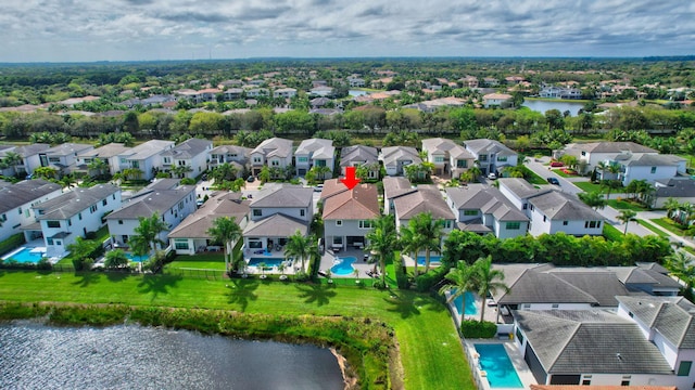 aerial view with a residential view and a water view