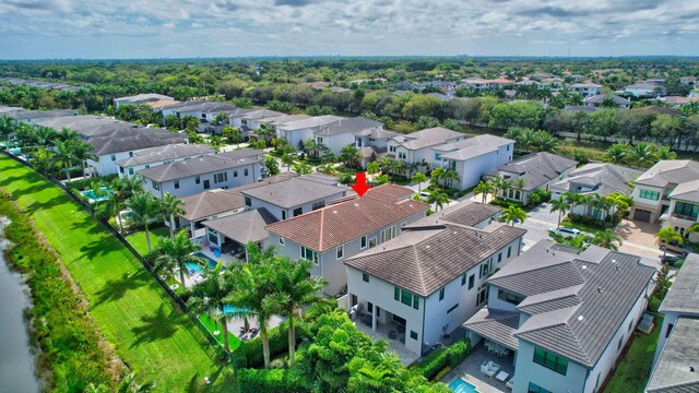 birds eye view of property with a residential view