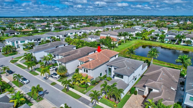 aerial view with a water view and a residential view