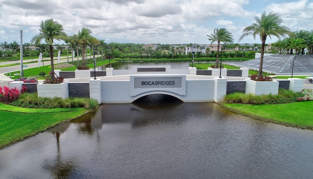 exterior space with a water view and a yard