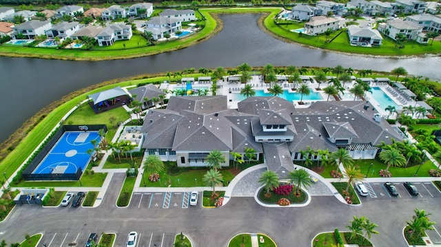 birds eye view of property featuring a residential view and a water view