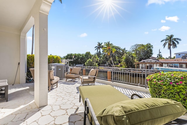 view of patio featuring a water view