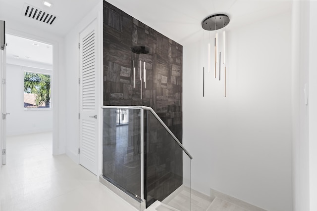 bathroom featuring tile patterned floors and a shower with shower door