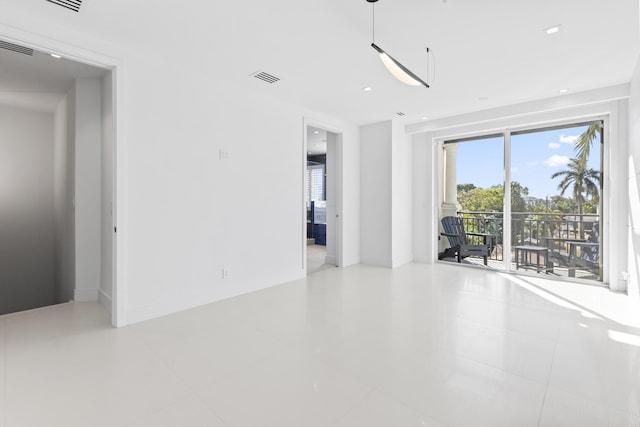 empty room with tile patterned flooring