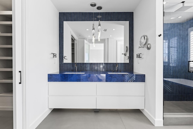 bathroom with a shower and vanity