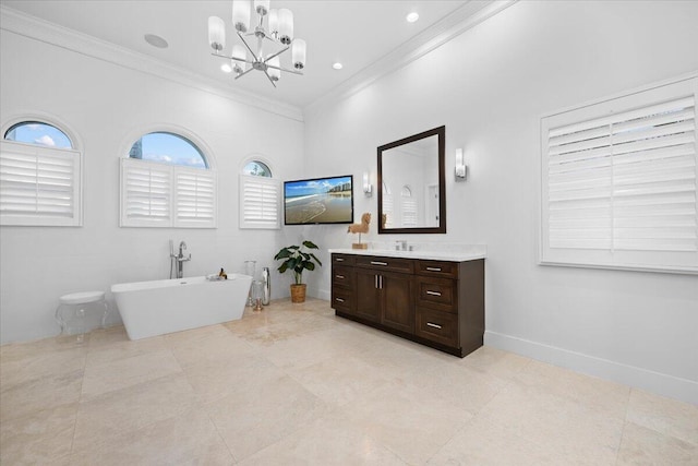 bathroom featuring a tub to relax in, crown molding, vanity, and a notable chandelier