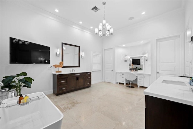 bathroom with a bathtub, vanity, an inviting chandelier, a towering ceiling, and ornamental molding