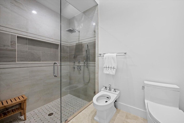 bathroom featuring walk in shower, tile patterned flooring, toilet, and a bidet