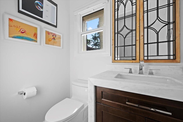 bathroom with vanity and toilet