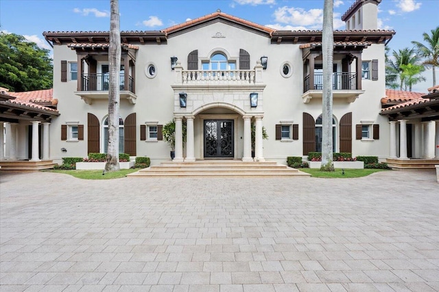 mediterranean / spanish-style home featuring french doors