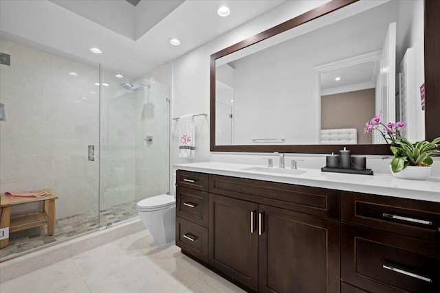 bathroom with tile patterned floors, vanity, toilet, and a shower with shower door