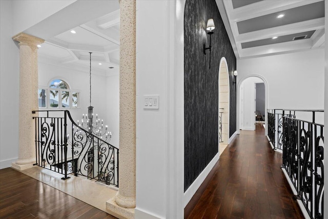 hallway featuring coffered ceiling, beamed ceiling, and dark hardwood / wood-style floors