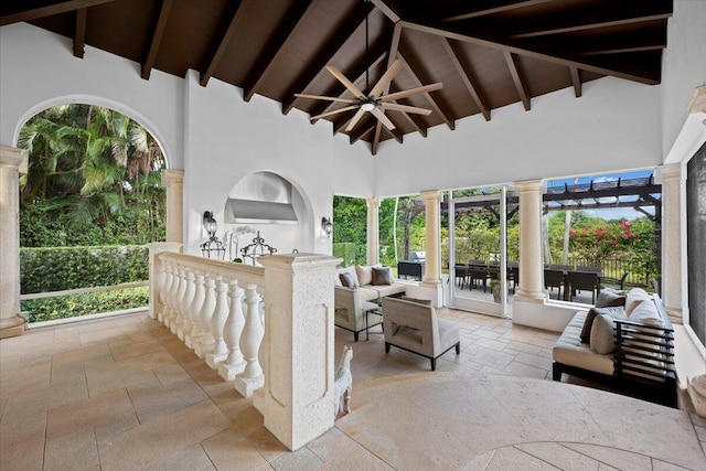 view of patio / terrace featuring an outdoor living space with a fireplace and ceiling fan