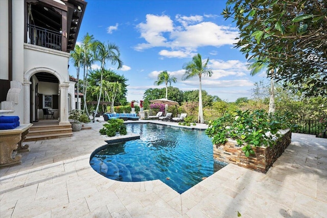 view of swimming pool with a patio area