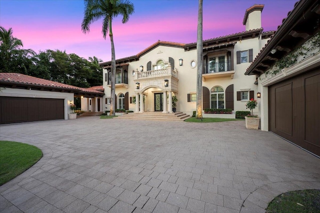 mediterranean / spanish-style home featuring a balcony