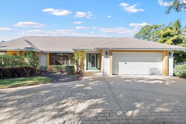 ranch-style house featuring a garage