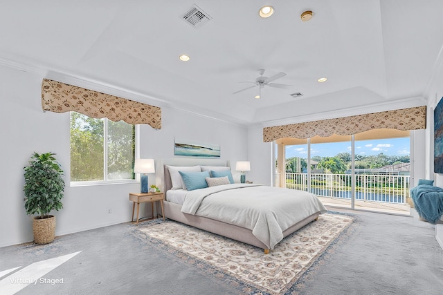 bedroom with ceiling fan, ornamental molding, a raised ceiling, and access to outside