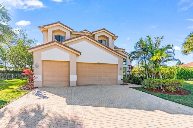 mediterranean / spanish-style home featuring a garage