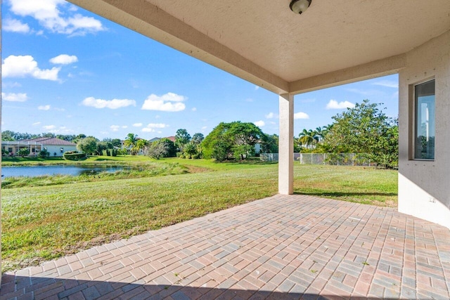 view of patio with a water view