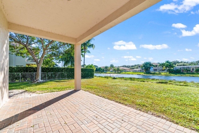 view of patio with a water view