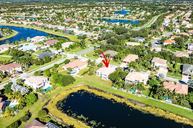 birds eye view of property featuring a water view