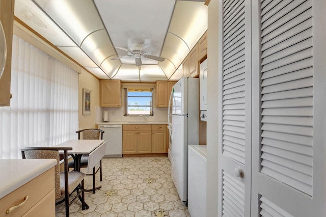 kitchen featuring ceiling fan, light brown cabinets, sink, white appliances, and light tile patterned floors