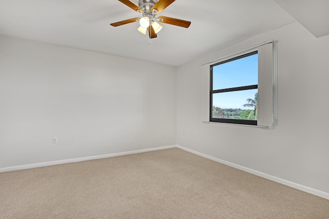 spare room with carpet flooring and ceiling fan