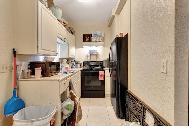 kitchen featuring black appliances and light tile patterned floors