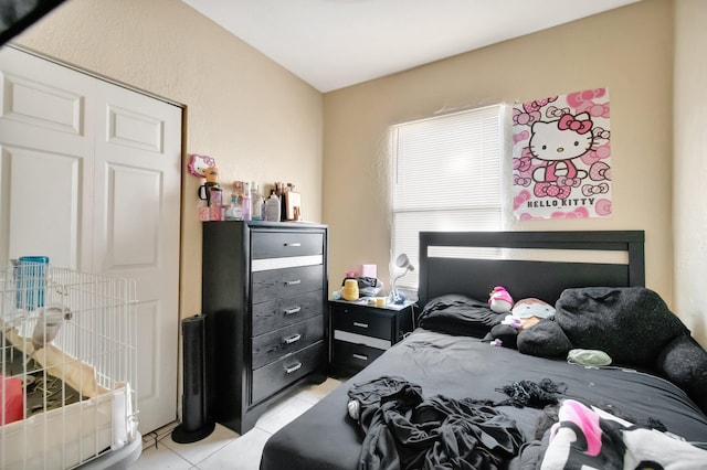 bedroom featuring light tile patterned floors