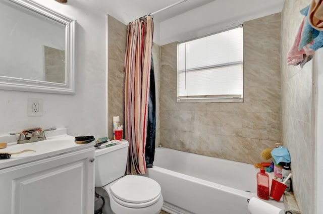 full bathroom featuring shower / bath combination with curtain, toilet, and vanity