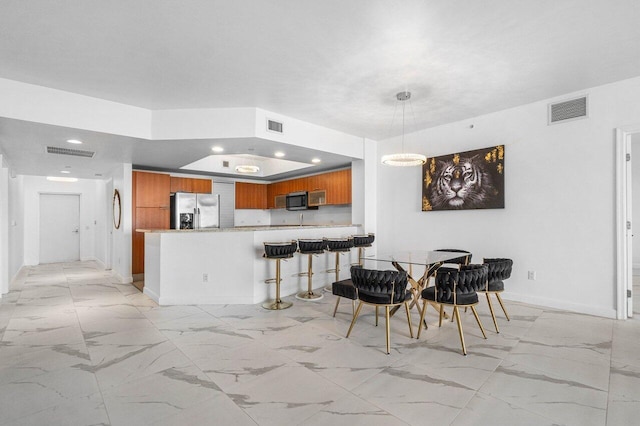 kitchen featuring kitchen peninsula and stainless steel appliances