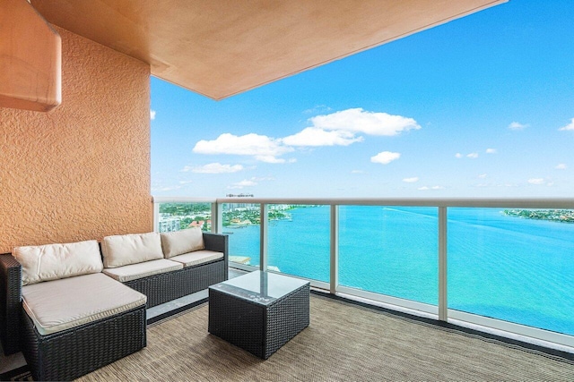 balcony featuring a water view