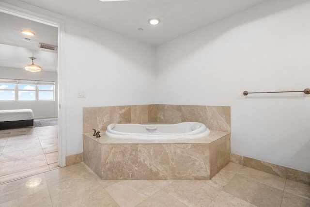 bathroom featuring tiled bath