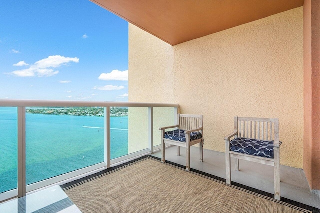 balcony featuring a water view