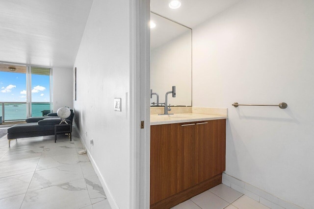 bathroom featuring vanity and a water view