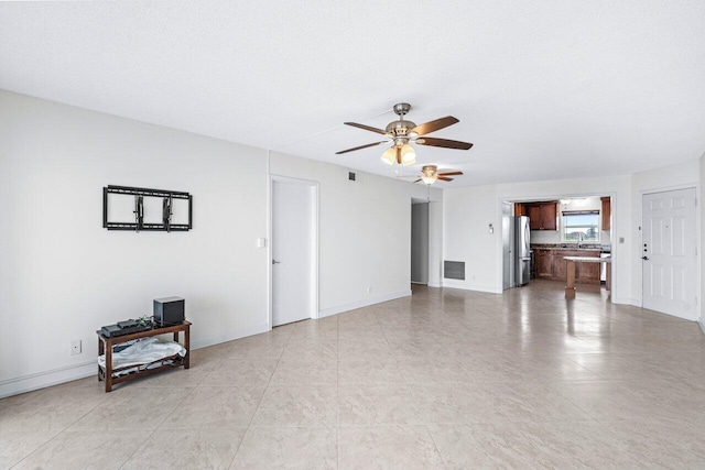 living room with ceiling fan and sink