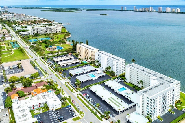 birds eye view of property with a water view