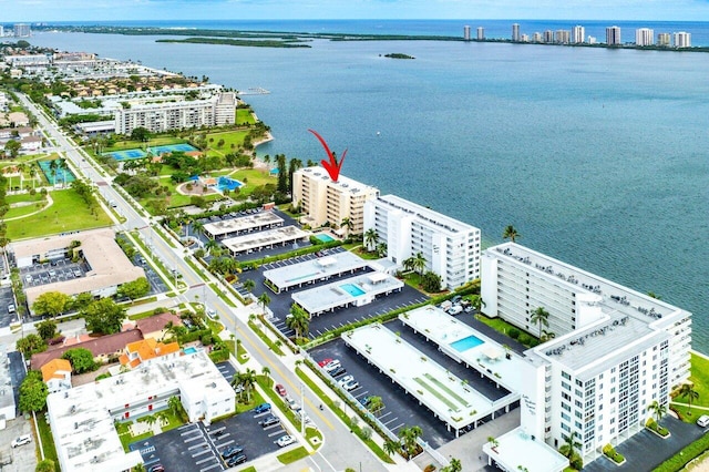 birds eye view of property with a water view