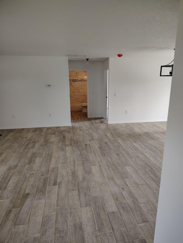 spare room featuring light wood-type flooring