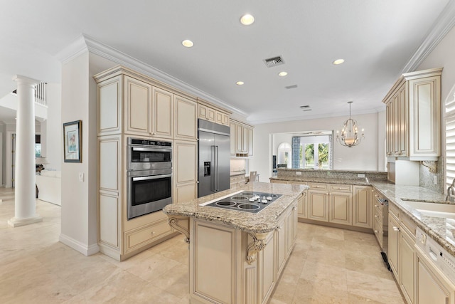 kitchen with a center island, an inviting chandelier, sink, kitchen peninsula, and stainless steel appliances